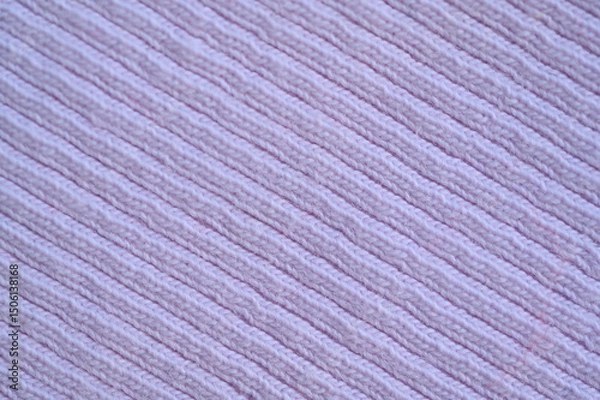 Fototapeta purple texture of knitted synthetic fabric as a background, pink smooth symmetrical lines of synthetic fabric