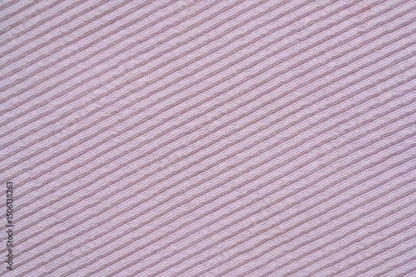 Fototapeta pink texture of knitted synthetic fabric as a background, pink smooth symmetrical lines of synthetic fabric