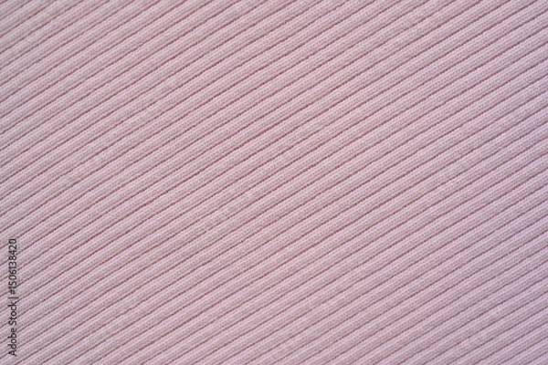 Fototapeta pink texture of knitted synthetic fabric as a background, pink smooth symmetrical lines of synthetic fabric