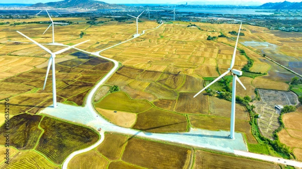 Obraz Panoramic view of wind farm or wind park. Wind turbines generating electricity on rice field at Phan Rang, Ninh Thuan, Vietnam. Clean energy concept