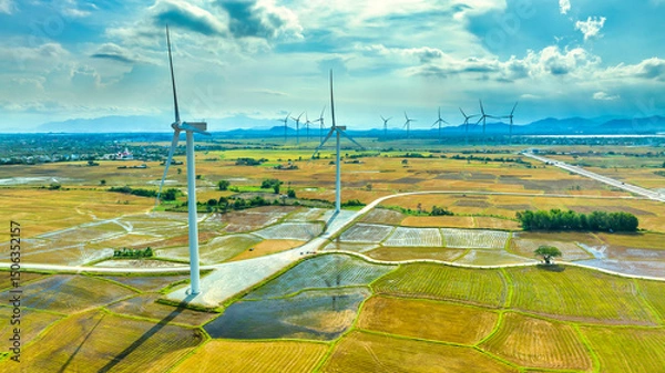 Obraz Panoramic view of wind farm or wind park. Wind turbines generating electricity on rice field at Phan Rang, Ninh Thuan, Vietnam. Clean energy concept
