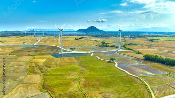 Obraz Panoramic view of wind farm or wind park. Wind turbines generating electricity on rice field at Phan Rang, Ninh Thuan, Vietnam. Clean energy concept