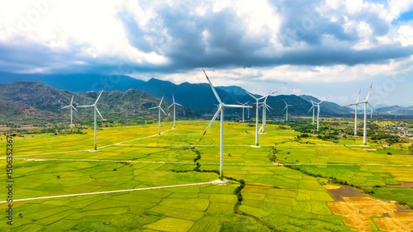 Obraz Panoramic view of wind farm or wind park. Wind turbines generating electricity on rice field at Phan Rang, Ninh Thuan, Vietnam. Clean energy concept