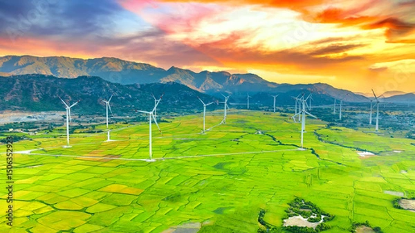 Obraz Panoramic view of wind farm or wind park. Wind turbines generating electricity on rice field at Phan Rang, Ninh Thuan, Vietnam. Clean energy concept