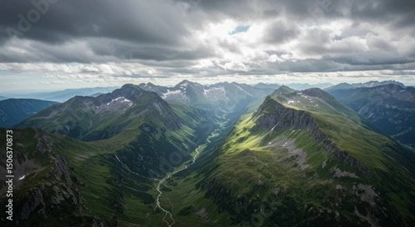 Fototapeta Aerial View of Mountain Valley with River and Cloudy Sky