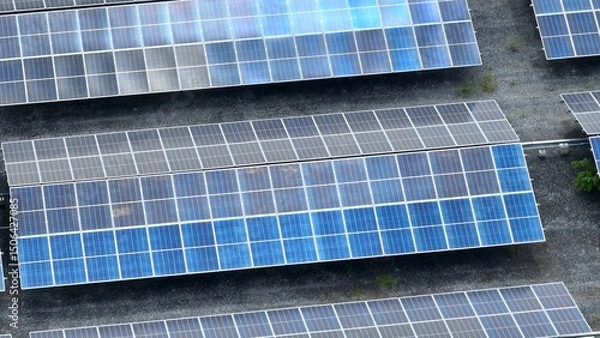 Obraz This aerial perspective emphasizes the wide-reaching impact of solar energy installations, showing the technological shift toward cleaner energy sources and large-scale renewable power generation.
