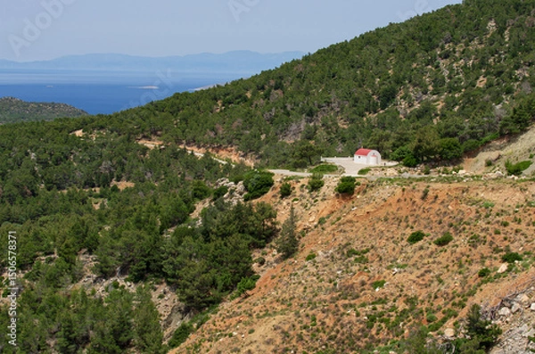 Fototapeta Beautiful mountainous landscape with a white Orthodox chapel and views of the Aegean Sea (Rhodes, Greece)