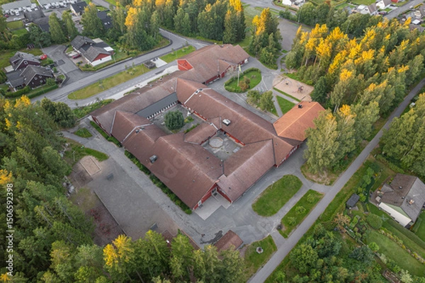 Fototapeta A modern school in a small European village. Drone view, concept of a building. 