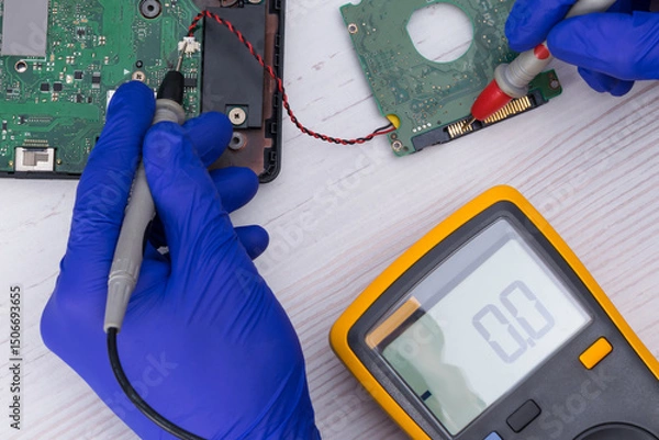Fototapeta A device for measuring voltage and diagnosing the phone's display board, close-up