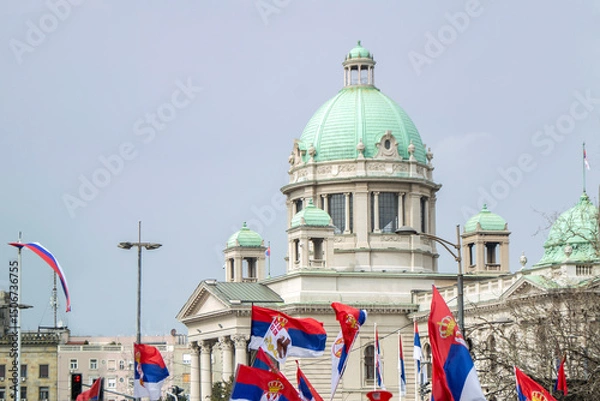 Obraz House of the National Assembly in Belgrade Serbia surrounded with many flags