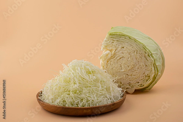 Fototapeta Cabbage radish into fine thin strips.