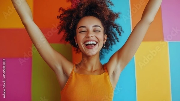 Obraz Radiant Euphoria: A Smiling Woman's Joyful Celebration on a Colorful Backdrop