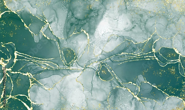 Fototapeta green alcohol ink graceful abstract ink flow art mixed with gold patterns with a translucent background.