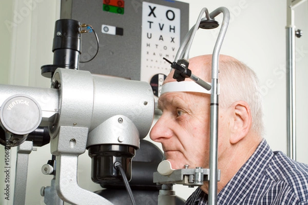Obraz Older man having eye examination