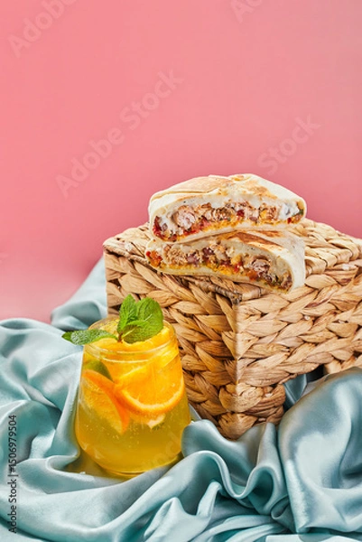 Fototapeta Stack is hybrid of taco, burrito and quesadilla, wrapped in tortilla and filled with beef or chicken, tomatoes, cheese and lettuce. Mexican-American dish