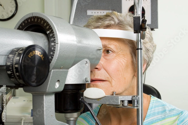 Obraz Lady having eye test examination