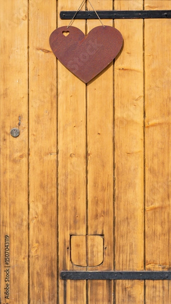 Obraz rustic wooden wwod barn door, with steel hinges and heart symbol for decoration