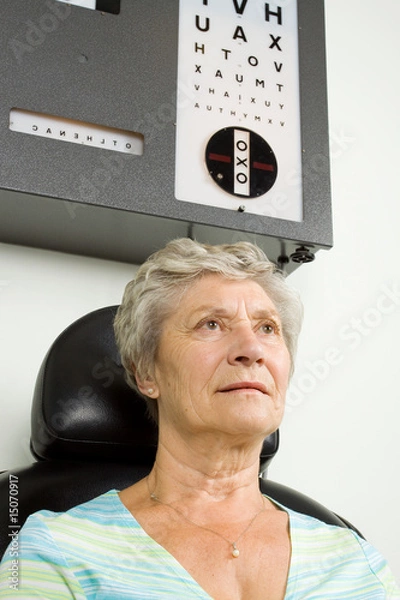 Obraz Lady having eye test examination