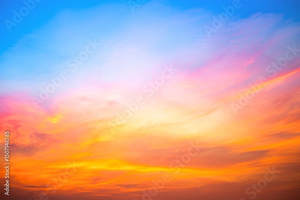 Fototapeta Sky,Beautiful sunset view, luxury soft gradient orange gold clouds and sunlight on the blue dramatic sky perfect for the background, morning, evening,Twilight, climate change,horizontal sunset photo