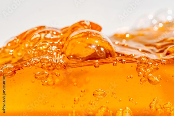Fototapeta Close up bright orange Oil or beer splash texture and nature waves, Beautiful waves curve and little bubbles smooth for graphic design and background, Oil Bubbles, Soft beer bubbles, Selective focus