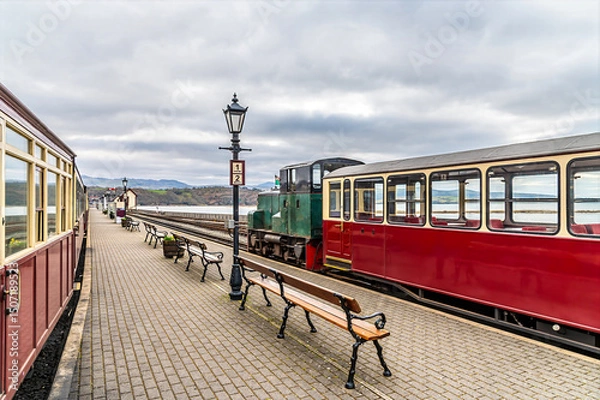 Fototapeta A view down the platform at the railway station at Porthmadog, Wales in springtime