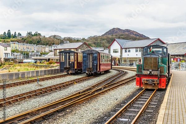 Fototapeta A view along the platform towards the railway station at Porthmadog, Wales in springtime