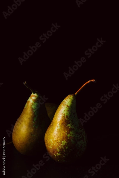 Obraz Pears on dark background.