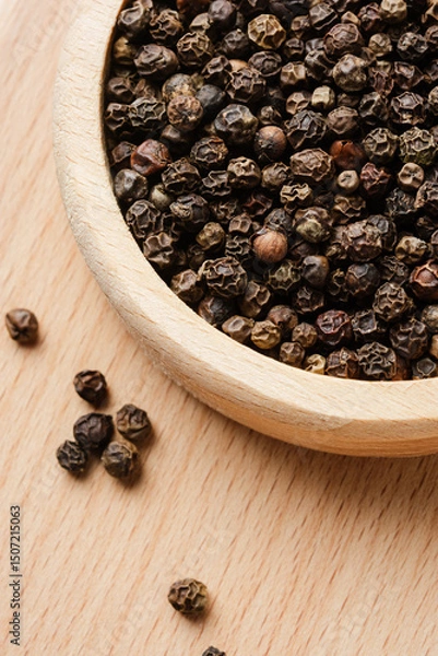 Obraz Whole black peppercorns.