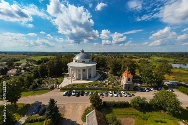 Fototapeta Aerial View of Round Church of the Holy Trinity Building Surrounded by Cemetery in Suderve Town Near Vilnius