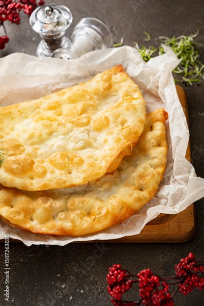 Fototapeta Cheese and meat homemade pastry cheburek top view meat pie