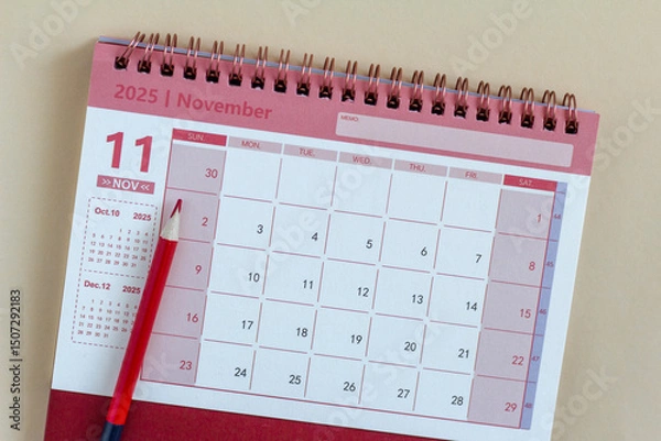 Fototapeta Hello, November 2025. A desktop calendar for planning on the table.