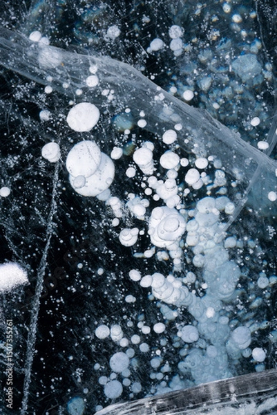 Obraz Gas methane bubbles frozen in blue ice of lake Baikal