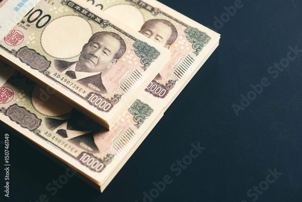 Fototapeta 黒いテーブルに置かれた一万円札の札束