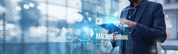 Obraz A businessman using a tablet is analyzing machine learning and its impact on accelerating business growth by leveraging data-driven insights, automating workflows, enhancing decision-making processes.