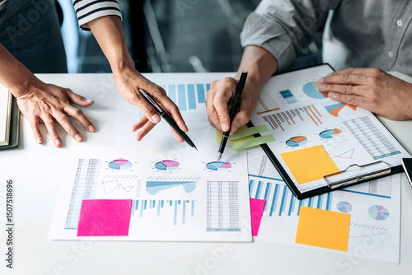 Obraz Business team colleagues consultation and discussion marketing plan meeting on the financial report and analyzing investment project to development grow to success