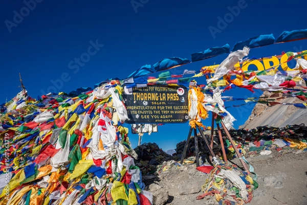 Obraz The waving prayer flags at the top of Thorung La Pass, the highest point of the Annapurna Circuit Trek in Himalaya mountains, Nepal.