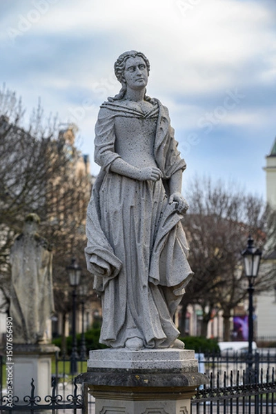 Obraz A statue of a saint (St Elizabeth of Portugal?) at the Plague Column dedicated to the Immaculate Virgin Mary in Košice, Slovakia.