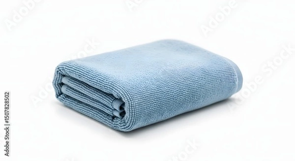Obraz A small, neatly folded microfiber gym towel in a light blue color, on a clean white background