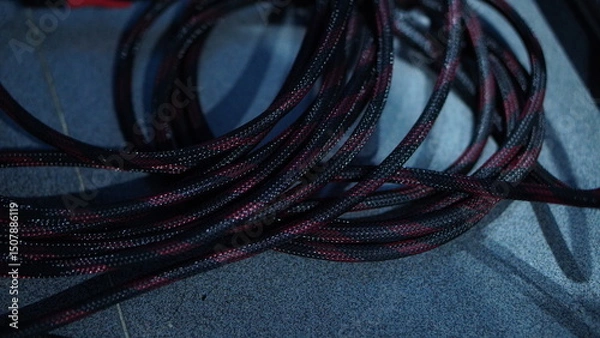 Obraz High-Resolution Close-Up of Black and Maroon Braided Cables