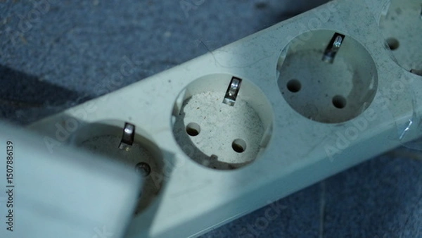 Obraz Close-up of a Dirty and Worn-Out Multi-Plug Power Strip