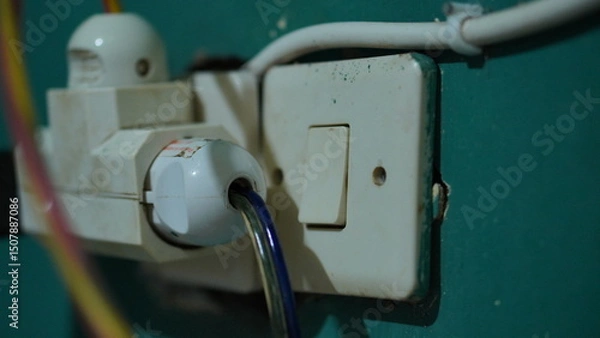 Obraz Close-up of Old Electrical Outlet and Switch on Teal Wall