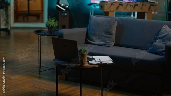 Obraz Modern apartment loft with a cozy corner and trendy furniture, comfy space decorated with electronics and a coffee table. Empty studio living room with minimalist decor, chill lifestyle.