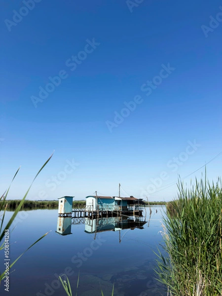Obraz Old fishing scales on stilts in the quiet of the Tuscan swamp