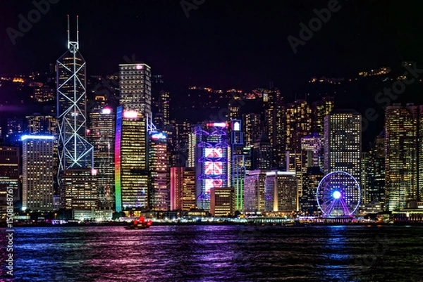 Fototapeta Vibrant Cityscape of Hong Kong Victoria Harbour at Night. The mesmerizing beauty of Hong Kong's Victoria Harbour at night, showcasing the dazzling illuminated skyline and reflections on the water.