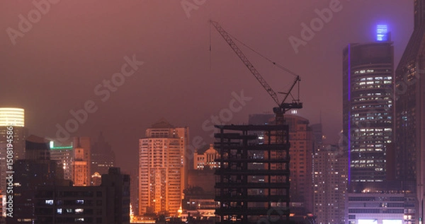 Fototapeta Shanghai, China. Development Residential Building. Shanghai Waitan Residential District. Urban Skyline In Evening Time. Night Illumination. Business District. City Business Center. Smog Over City