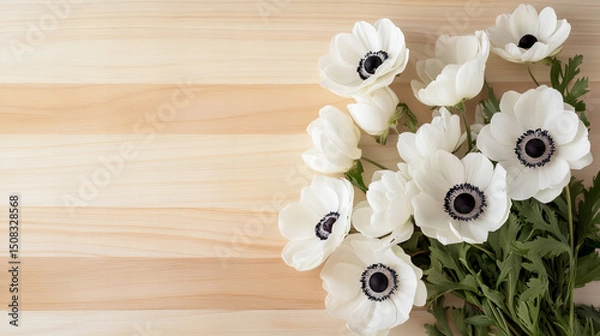 Obraz White anemone and daisy flowers arranged on natural wooden backgrounds, perfect for spring, greeting cards, and rustic-themed designs.

