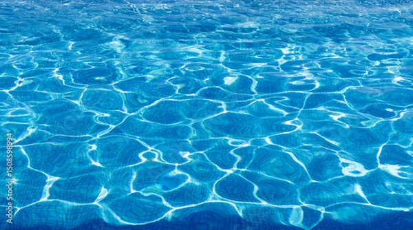 Fototapeta Water in swimming pool, ripple water surface and sun reflection