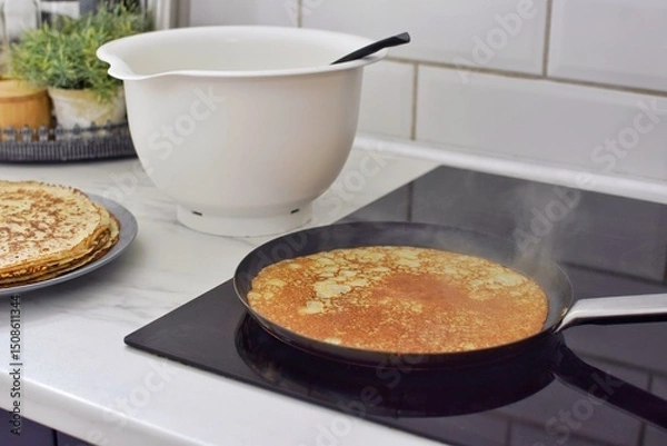 Obraz Making thin pancakes, home cooking.