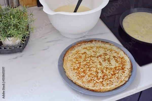 Obraz Making thin pancakes, home cooking.