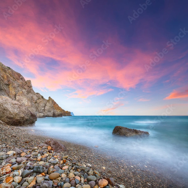 Fototapeta Amazing view of the beach and rocks shot with a long exposure.